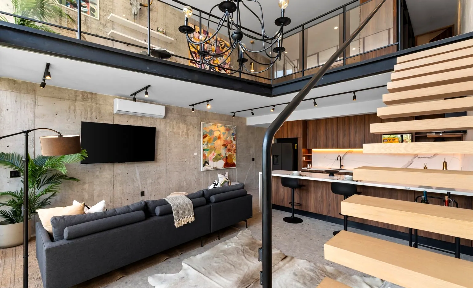 The double-height great room — play the film
