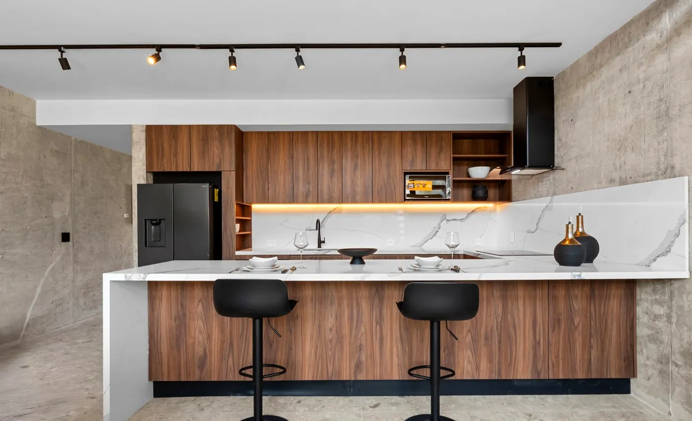 Marble island kitchen with bar stools