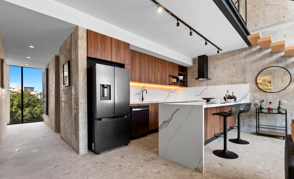 Kitchen with walnut cabinetry and a green view