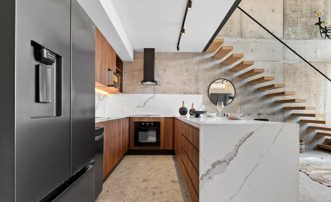 Kitchen with the floating stair beyond