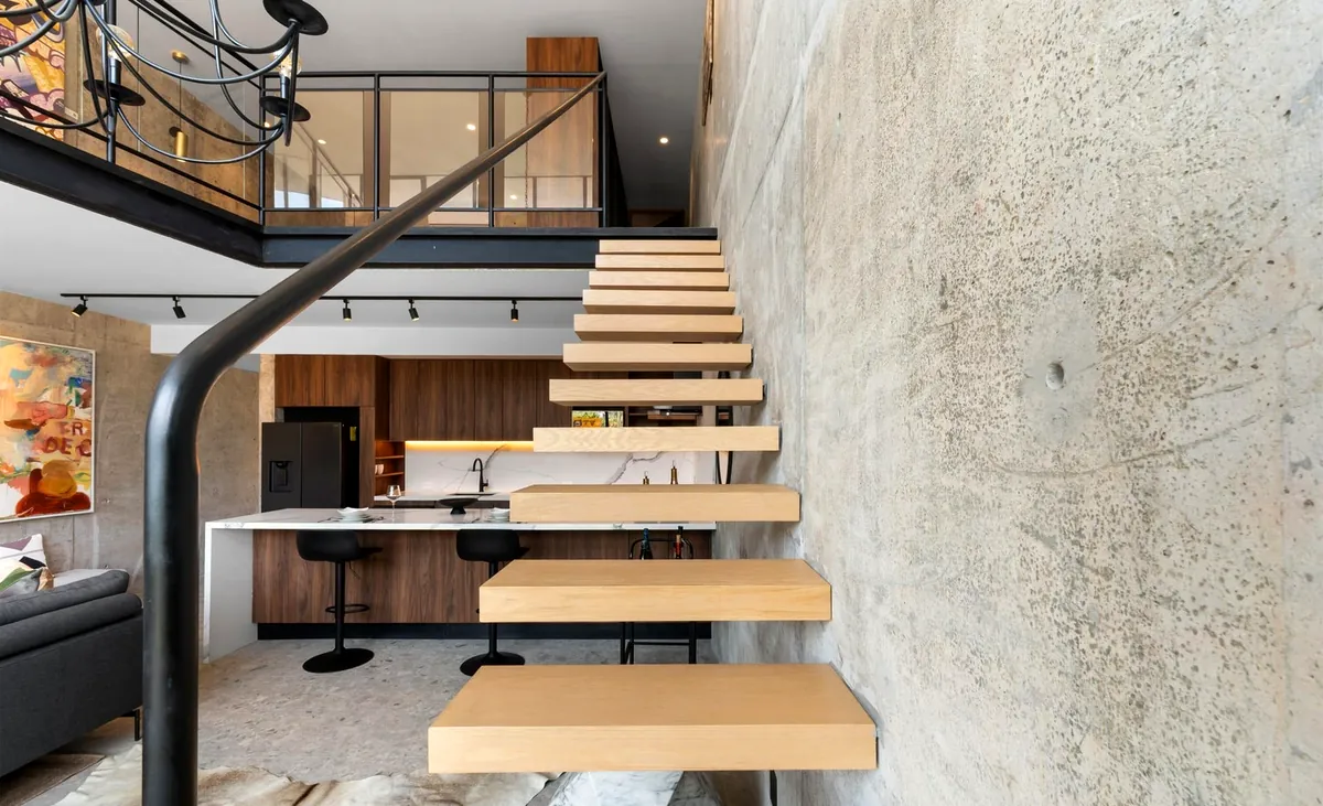 Sculptural floating staircase in wood and steel