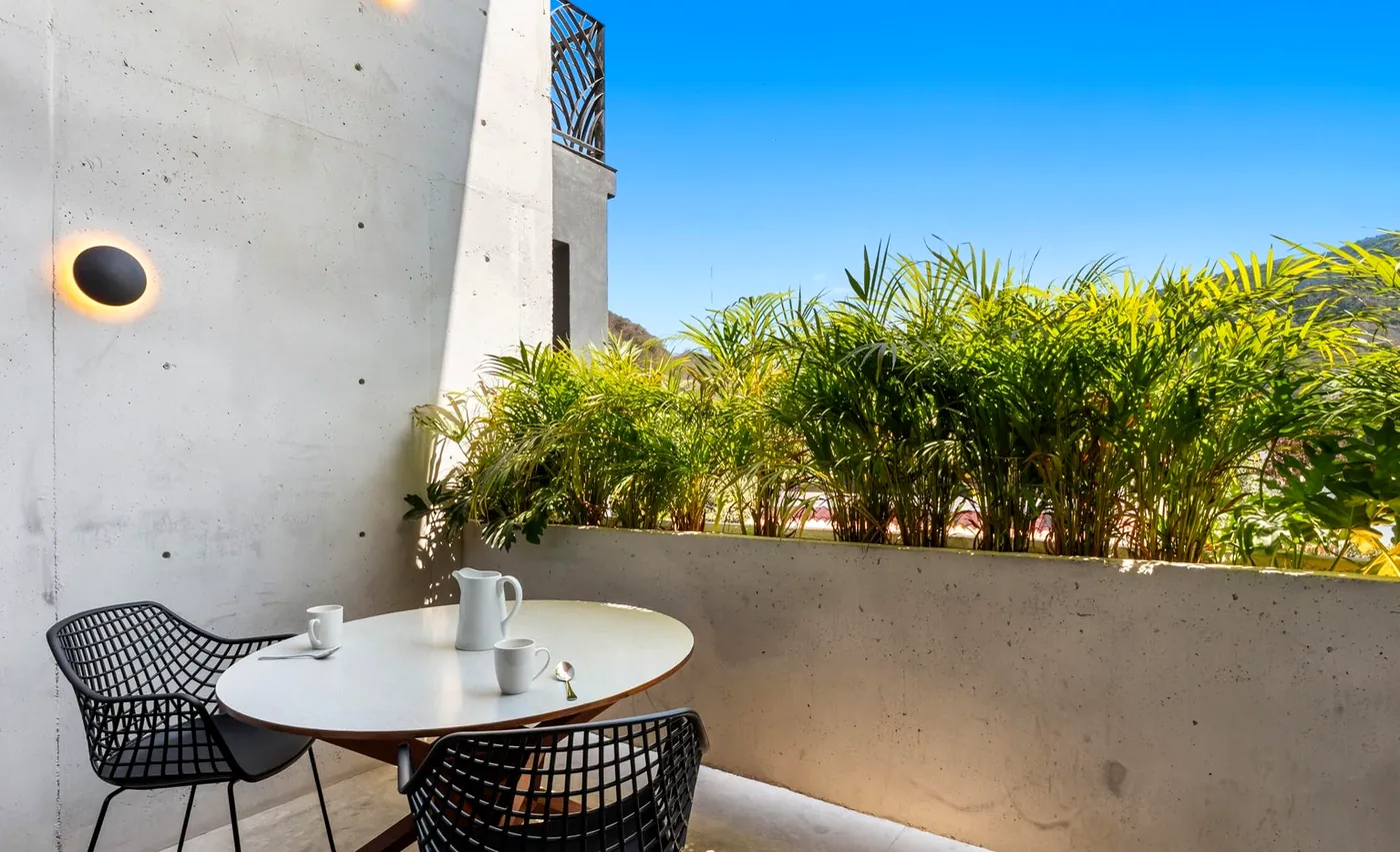 Private terrace with greenery and a table for two