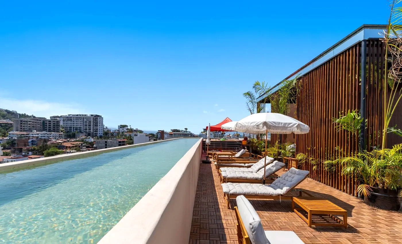 Rooftop infinity pool stretching toward the view