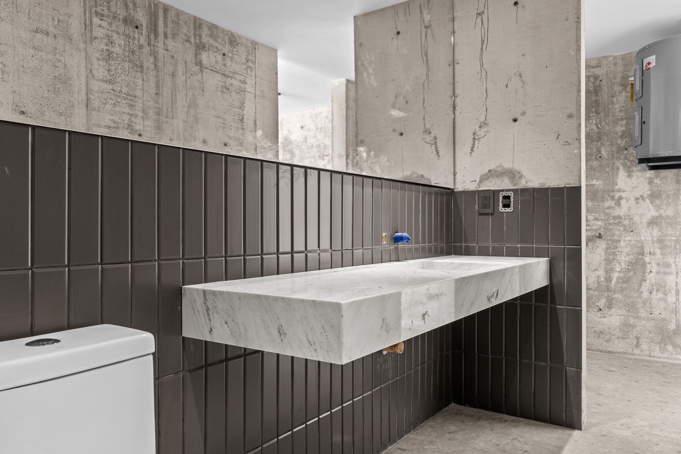 Sculpted marble basin in soft, pure light