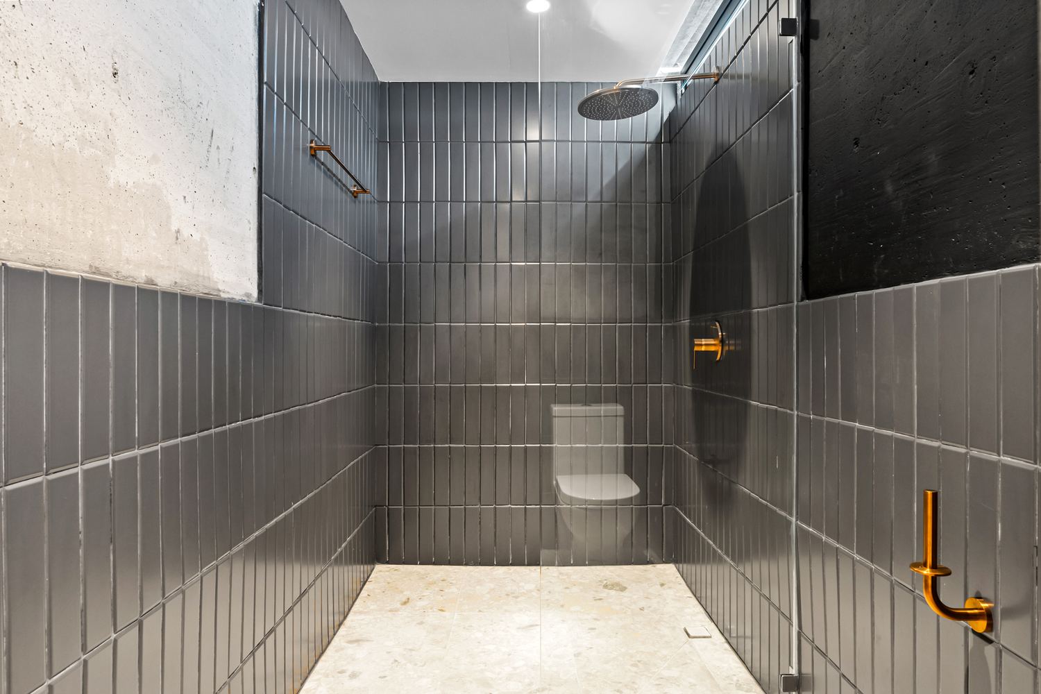 Walk-in rain shower with warm fixtures